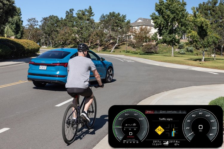 Tableau de bord Audi affichant une alerte V2X de détection cycliste